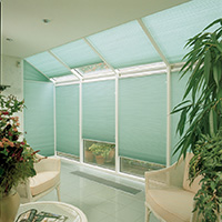 Wide angle photo of aqua coloured Velux Blinds